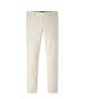 The Surge Performance Trouser by Peter Millar is a pair of beige flat-front trousers made from performance fabric, shown against a white background.