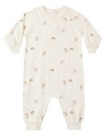 The Rylee & Cru Baby Raglan Jumpsuit is a cream-colored long sleeve romper with legs, adorned with a charming pattern of small hedgehogs and dots. Made from soft French terry, this adorable jumpsuit provides cozy comfort for your little one, making it perfect for everyday wear.