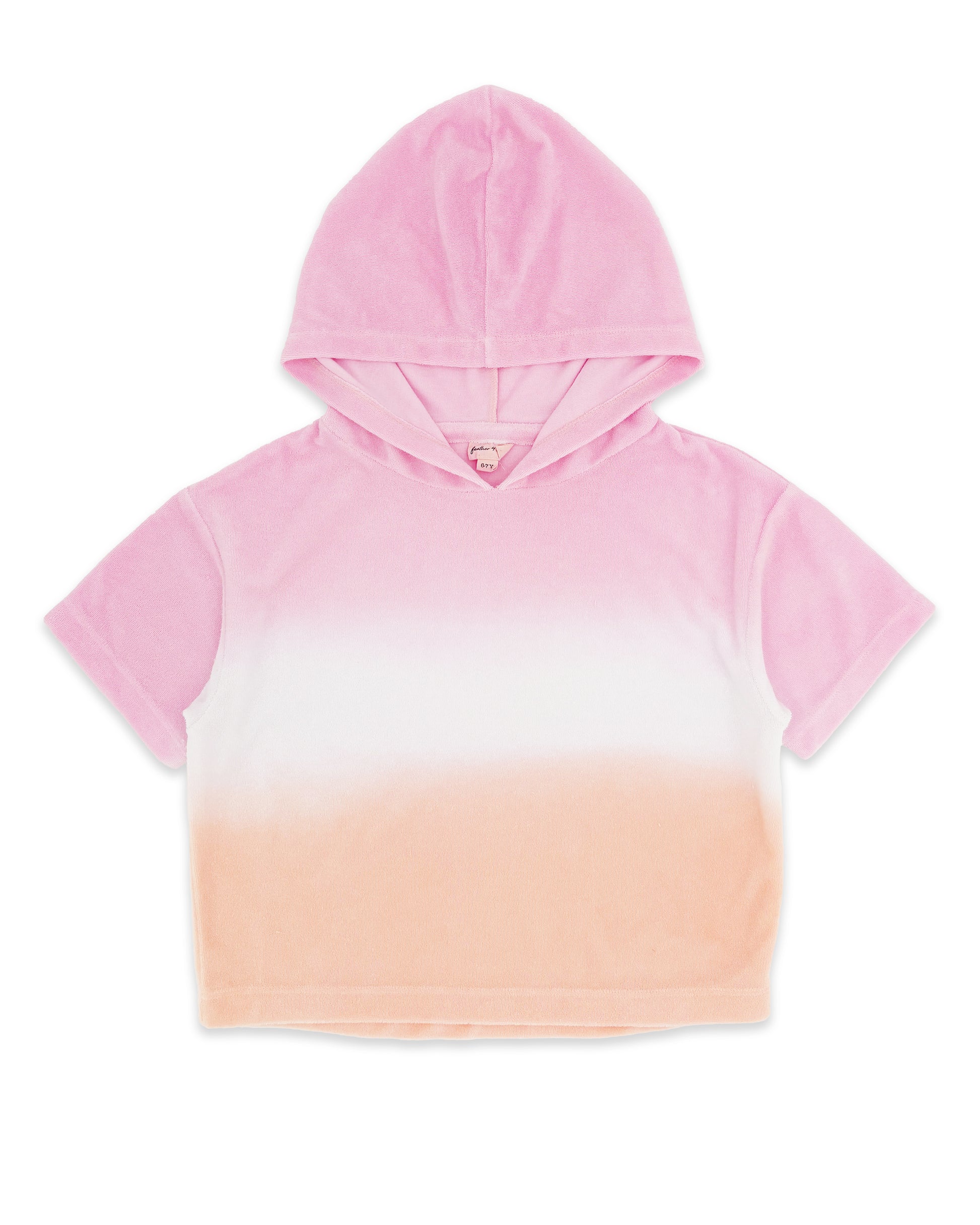 The Girls’ Terry Hoodie by Feather 4 Arrow features a pastel sunset ombre design in shades of pink and peach, crafted from soft velvety terry cloth; this short-sleeve hooded top is displayed laid flat on a white background.