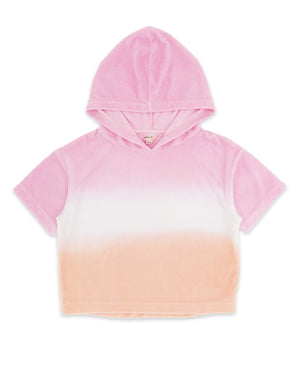 The Girls’ Terry Hoodie by Feather 4 Arrow features a pastel sunset ombre design in shades of pink and peach, crafted from soft velvety terry cloth; this short-sleeve hooded top is displayed laid flat on a white background.