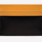 The Ettinger Bridle Flat Credit Card Case features a two-tone bridle hide leather design with a yellow upper section, black lower section, and visible stitching.