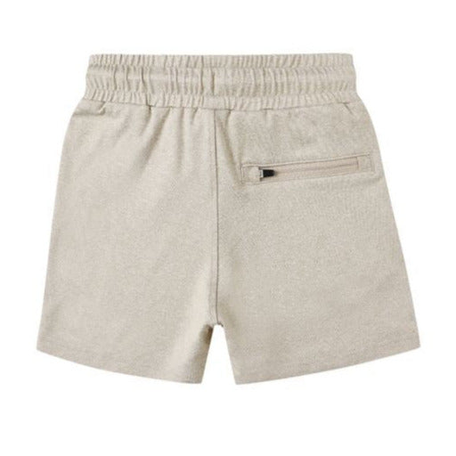 The Boys' Oceanside Tech Short by Rylee & Cru features a beige color, elastic waistband, front pockets, and a zippered back pocket, shown on a plain white background.