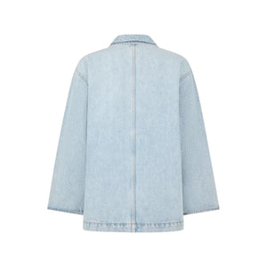 Back view of the light blue Nariida Cory Jacket by Blaze Milano, a denim blazer with long sleeves and a straight hem, shown against a white background.