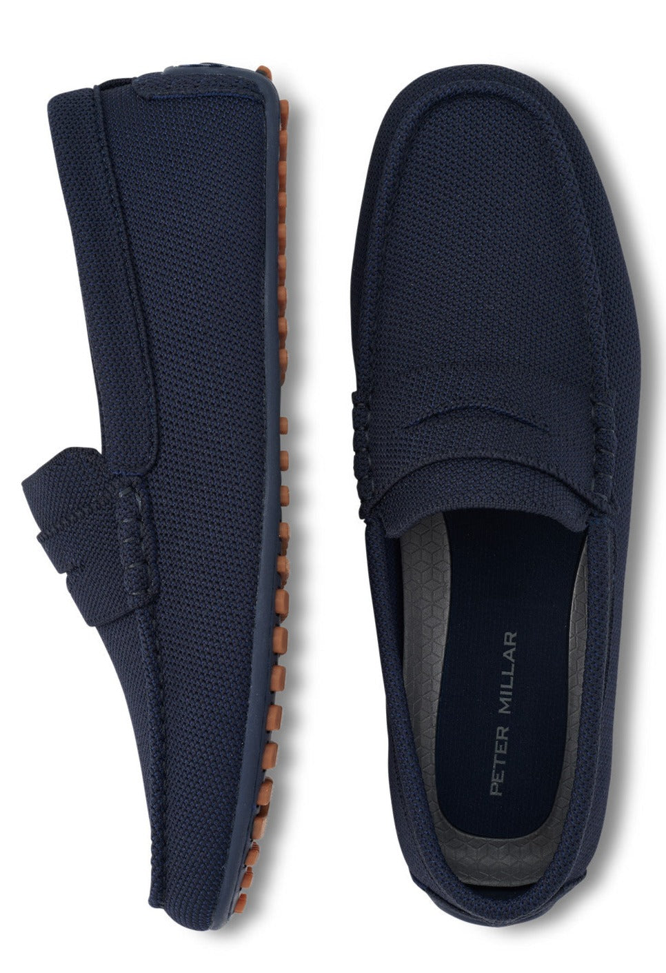 A pair of Peter Millar men's navy blue slip-on loafers, featuring breathable performance uppers, displayed against a white background.