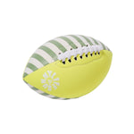 Introducing the Sunnylife Tides Out Citrus Neoprene Football—a lightweight football crafted from sustainable natural rubber, showcasing white and green stripes on one side, solid yellow on the other, white laces, and finished with a distinctive sun-shaped logo.