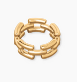 The Isabel Ring by Lie Studio is a timeless gold piece with an openwork design, showcasing interlinked rectangular segments, set against a white background.