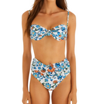 Woman wearing the Flora Tile Off White Bikini by Farm Rio, featuring a structured underwire top and high-waisted bottoms in white with blue and orange floral print.