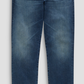 Everett Denim men’s slim straight jeans in medium-wash blue stretch denim.