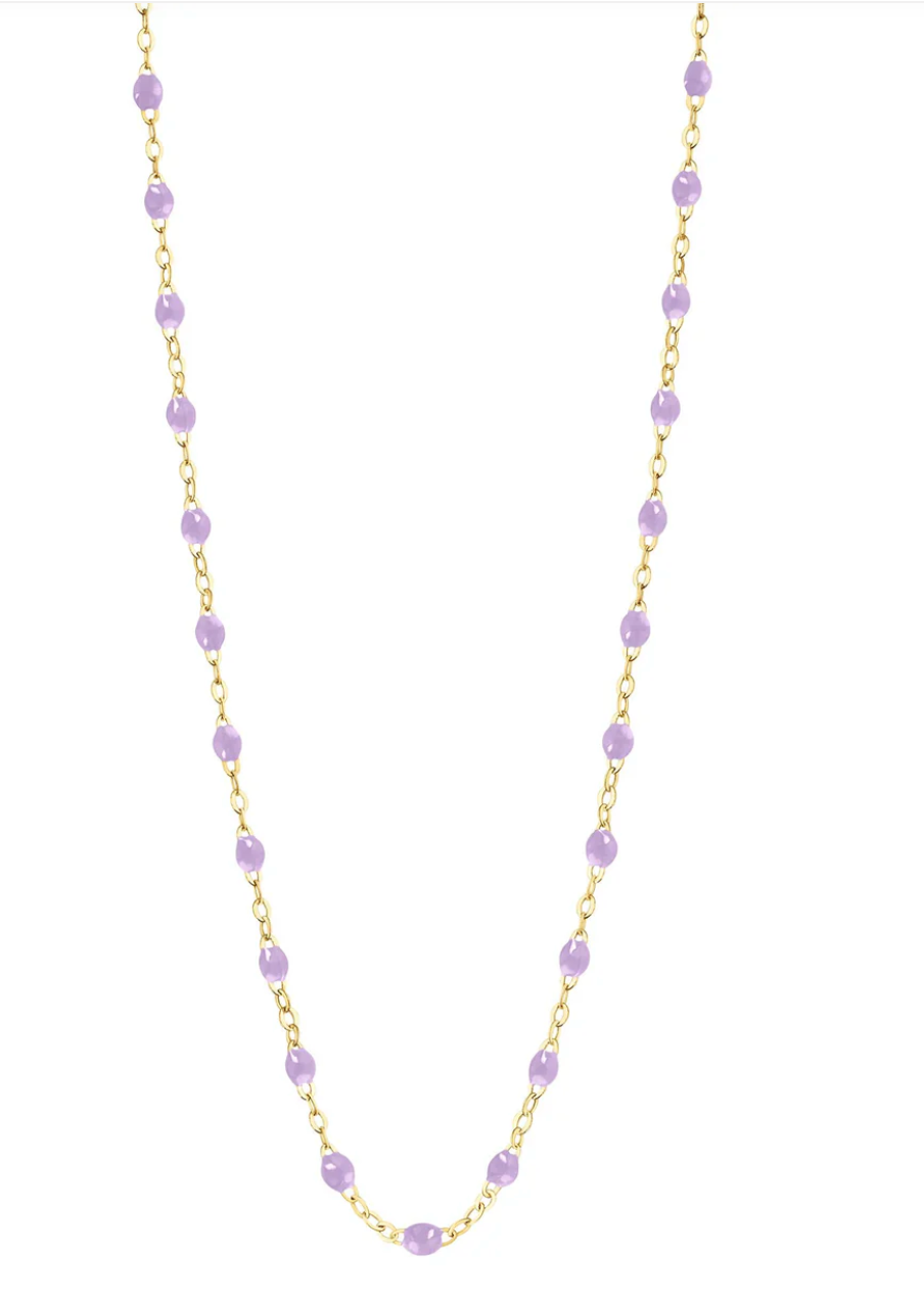 The Gigi Clozeau Classic Gigi Necklace 19.7" showcases a sophisticated 18 carat yellow gold chain embellished with delicate light purple beads, evenly spaced throughout.