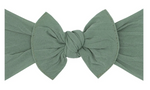 A large, green Baby Bling Classic Knot Headband crafted from high-quality material features a perfect knot in the center.