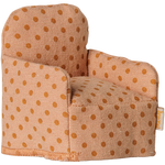 The Maileg Folding Chair, Mouse - Dots is a small upholstered armchair featuring light brown fabric with darker brown polka dots, perfect for your Maileg friends in the Mouse hole Farmhouse and shown here against a white background.
