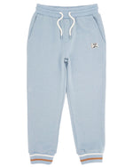 Introducing the Feather 4 Arrow Baby Boys’ and Boys’ Bowie Outside Jogger: light blue joggers with a relaxed fit, featuring a white adjustable drawcord, front pockets, ribbed cuffs accented with tan and white stripes, and a small patch on the left hip. These lightweight joggers are perfect for all-day comfort and style.