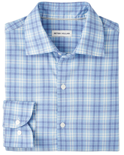 The Peter Millar Bar Harbor Performance Flannel Sport Shirt features a blue and white plaid pattern, long sleeves, and soft performance fibers—an ideal fall shirt with the "Peter Millar" label inside the collar.
