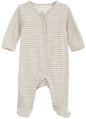 The Serendipity Newborn Rib Stripe Bodysuit is a long-sleeve, footed onesie made from organic cotton, featuring beige and white horizontal stripes, front snap button closures, and a round neckline, shown laid flat on a white background.