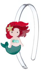 Introduce some sparkle to any outfit with the Lillies & Roses Mermaid Underwater Glitter Red Headband—a clear plastic headband adorned with a glittery cartoon mermaid featuring red hair, a gold starfish accessory, and a shimmering green tail for a magical finishing touch.