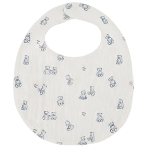 White newborn Bib by Tartine et Chocolat, featuring blue teddy bear illustrations and a small front button, crafted from soft, unbleached cotton for a gentle baby mealtime accessory.