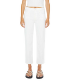 A person wears The Newbie Ankle high-rise stretch denim jeans by Mother, paired with a white crop top and black sandals, standing against a plain background.