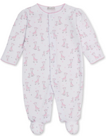 The Kissy Kissy Baby Just Giraffes Printed Footie is a white long-sleeve sleeper, beautifully crafted from soft Peruvian cotton. It features a delightful pink giraffe print with small star accents, delicate hand embroidery for added charm, and convenient snap buttons down the front.