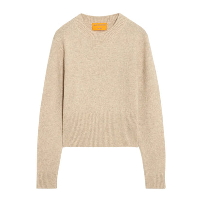 The Alina Cashmere Crew by Guest in Residence is a beige, long-sleeve marled knit sweater with a crew neckline and ribbed cuffs, hem, and collar, shown flat on a white background.