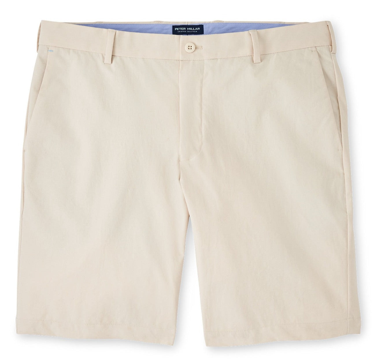 A pair of Peter Millar men's light-colored, water-resistant Surge Performance Shorts with a button closure and visible waistband laid flat against a white background.