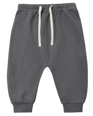 Quincy Mae Baby Boys’ and Boys’ Sweatpant in gray, featuring an elastic waistband, white drawstring, and ribbed cuffs, laid flat on a white background.
