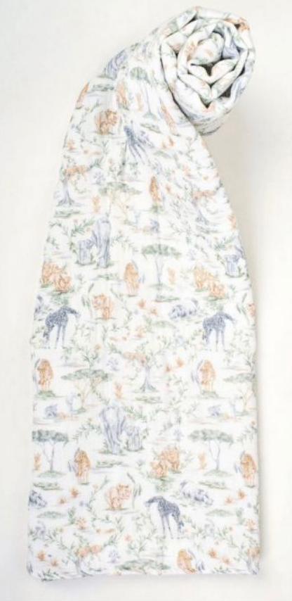 Timo & Violet Shawl Blanket made from soft organic cotton muslin, showcasing a gentle safari animal and plant pattern in muted tones, rolled at the top and displayed flat against a plain background.