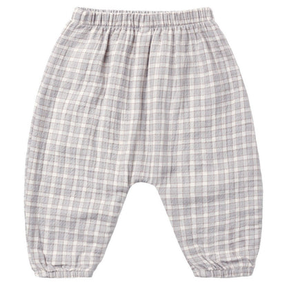 Quincy Mae Baby Boys’ and Boys’ Woven Pant in gray and white plaid, designed with an elastic waistband and gathered ankles, shown laid flat on a white background for a relaxed fit look.