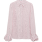 The Striped Ease Blouse by Dorothee Schumacher is a long-sleeved, collared design in lightweight organdy voile, featuring vertical pink and black stripes and elegant balloon cuffs.
