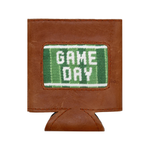 The Smathers & Branson Game Day Can Cooler features brown leather and a green and white stitched patch reading "GAME DAY" on the front. Blending timeless style with practical design, this can cooler keeps your beverage cold while bringing a sporty flair to any event.