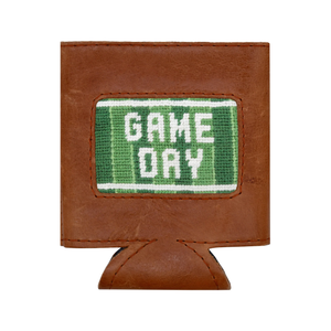 The Smathers & Branson Game Day Can Cooler features brown leather and a green and white stitched patch reading "GAME DAY" on the front. Blending timeless style with practical design, this can cooler keeps your beverage cold while bringing a sporty flair to any event.