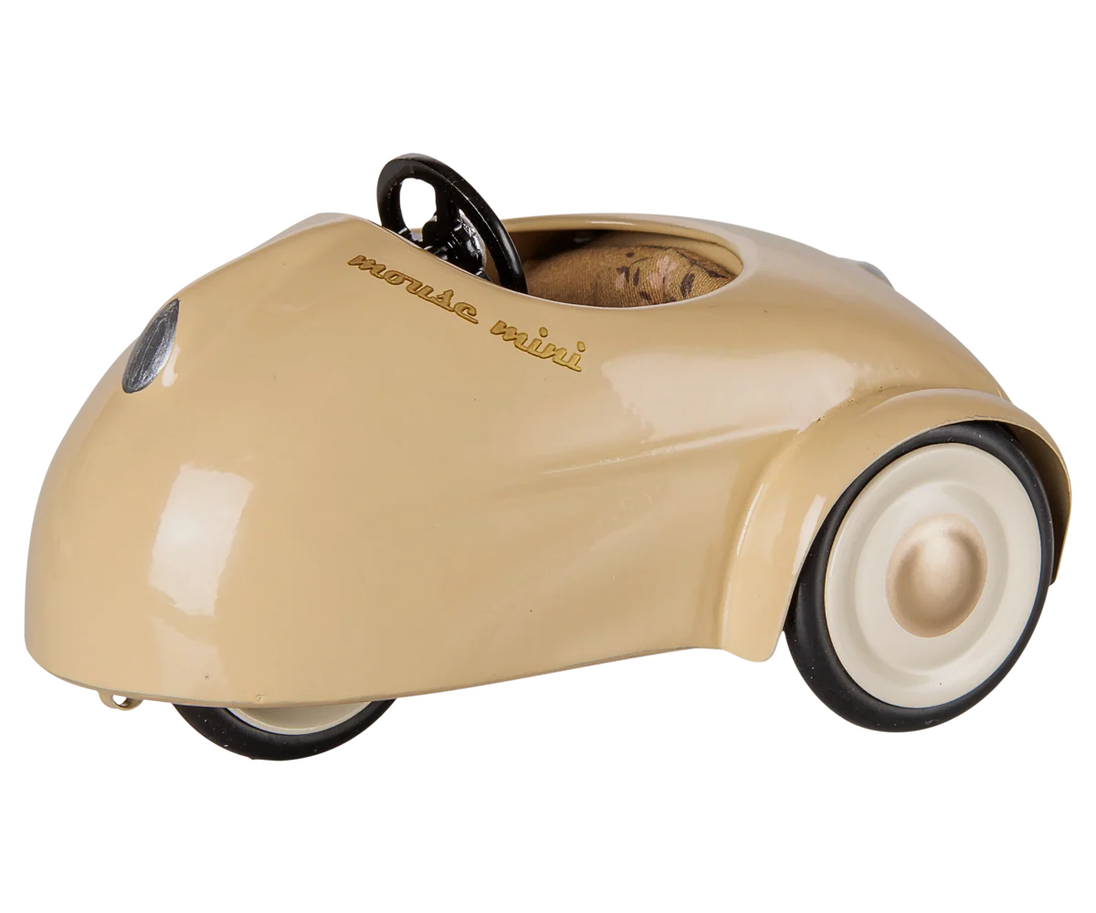 Beige, vintage-style “Car, Mouse - Wheat” by Maileg, featuring white wheels, a black steering wheel, and photographed on a plain white background.