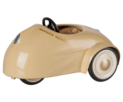 Beige, vintage-style “Car, Mouse - Wheat” by Maileg, featuring white wheels, a black steering wheel, and photographed on a plain white background.