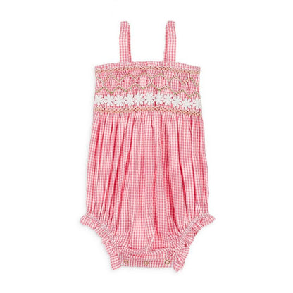 The Louise Misha Francesca Romper from Louise Misha boasts a textured pink gingham design with a smocked top, delicate white floral trim, and charming straps.