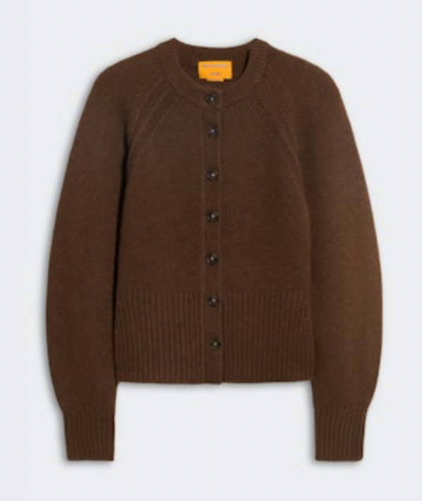 The Sculpted Cardigan by Guest in Residence is a brown, long-sleeve cashmere piece with ribbed cuffs, hem, and collar and classic button-up styling, shown on a light background.