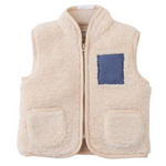 The Baby Orazio Sherpa Vest from Gingersnaps features a cream-colored plush sherpa design with a front zipper, two lower front pockets, and a contrasting blue chest pocket on the left side—making it the perfect cozy layering piece.