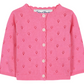 The Tartine et Chocolat Baby Girls’ and Girls’ Openwork Cardigan is crafted in a soft pink knit with a delicate eyelet pattern, long sleeves, classic white buttons down the front, and a charming ruffled neckline—an ideal layering piece for any occasion.