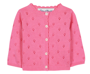 The Tartine et Chocolat Baby Girls’ and Girls’ Openwork Cardigan is crafted in a soft pink knit with a delicate eyelet pattern, long sleeves, classic white buttons down the front, and a charming ruffled neckline—an ideal layering piece for any occasion.
