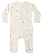 The Quincy Mae Baby Ribbed Jumpsuit is a long-sleeve, cream-colored piece with a slim-fit rib knit design, decorated with an adorable pattern of tiny moons, stars, and dots. It features front buttons and convenient snaps at the legs for easy changes.