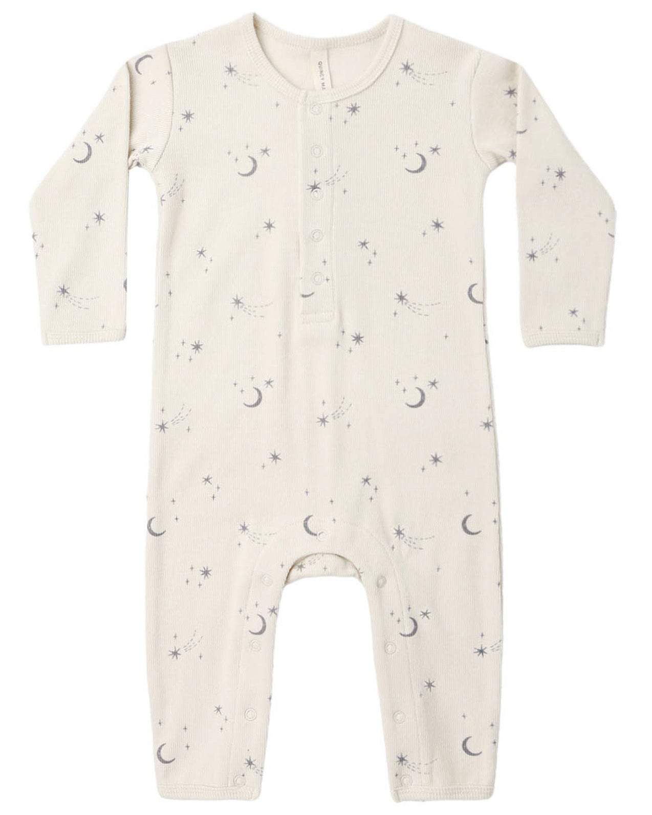 The Quincy Mae Baby Ribbed Jumpsuit is a long-sleeve, cream-colored piece with a slim-fit rib knit design, decorated with an adorable pattern of tiny moons, stars, and dots. It features front buttons and convenient snaps at the legs for easy changes.