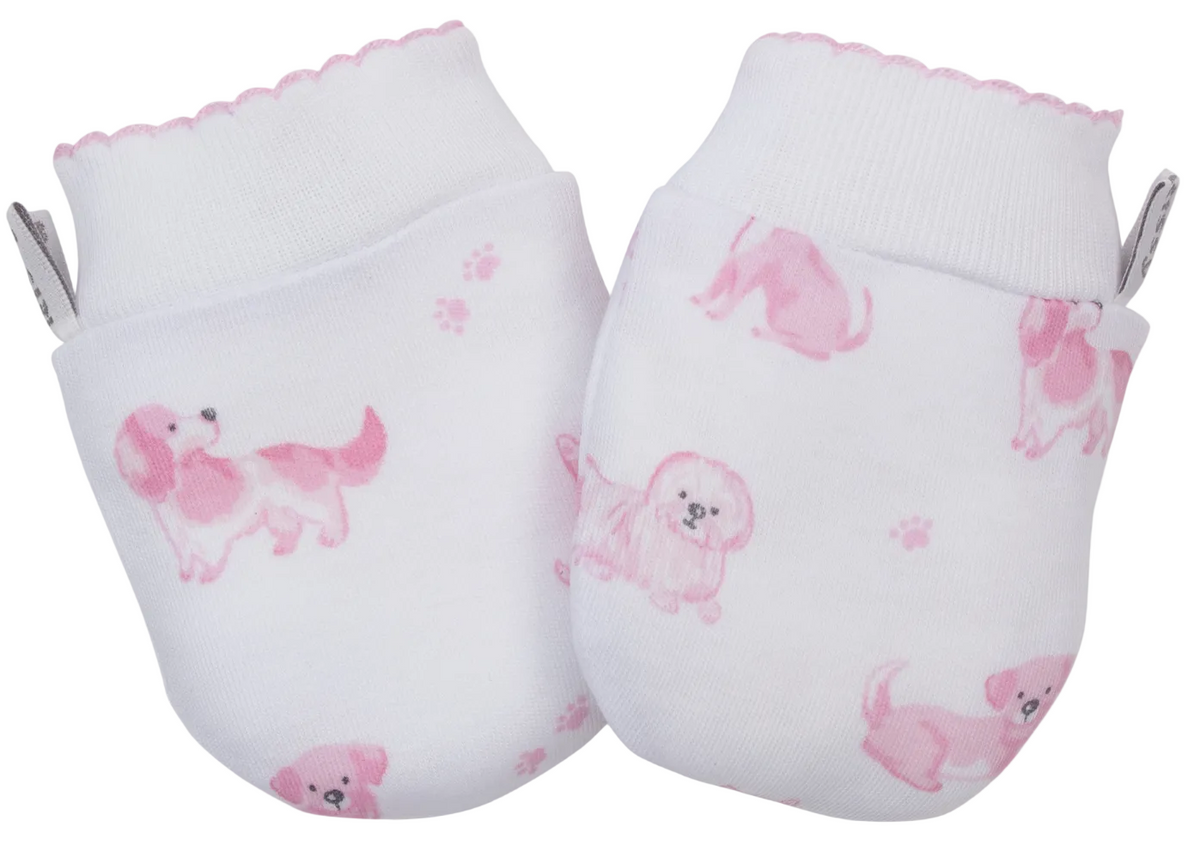 The Kissy Kissy Puppy Paws Printed Mitts for newborns are crafted from soft Pima cotton in white, featuring pink dog illustrations and paw prints, scalloped edges, and small ribbon loops on the side.