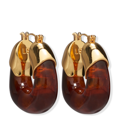 The Lizzie Fortunato Organic Gold Hoops feature chunky, translucent brown resin hoops and gold-tone metal tops, shown against a white background.