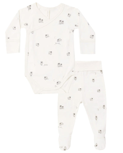 The Quincy Mae Baby Side Snap Bodysuit + Pant Set includes a white long-sleeve side snap bodysuit and coordinating footed pants, both decorated with a subtle light grey animal print.