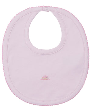 The Kissy Kissy Premier Noah's Ark Bib with Hand Emb. is a light pink Pima cotton bib featuring scalloped edges, an embroidered cake design in the center, and a snap closure at the neck.