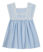 The Girls’ Briska Dress by Louise Misha features a light blue, sleeveless Oxford cotton design with a square neckline, gathered waist, and white embroidered floral details adorning the front yoke and straps.