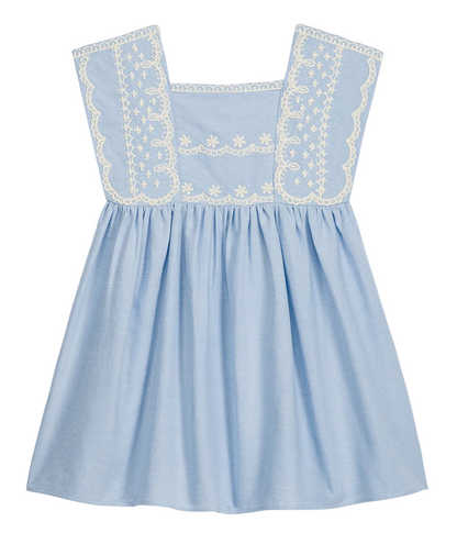 The Girls’ Briska Dress by Louise Misha features a light blue, sleeveless Oxford cotton design with a square neckline, gathered waist, and white embroidered floral details adorning the front yoke and straps.