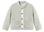 The Rylee & Cru Baby Girls’ and Girls’ Chalet Jacket in light gray features long sleeves, cozy front pockets, a quilted button placket, and white trim along the edges.