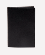 The Ettinger Capra Passport Case in black Capra leather is shown standing upright against a plain white background.