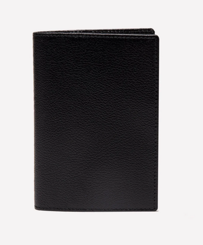 The Ettinger Capra Passport Case in black Capra leather is shown standing upright against a plain white background.
