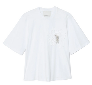 The 3.1 Phillip Lim Trapeze T-Shirt with Floral Applique features a plain white design, short sleeves, subtle textured white floral embroidery, and small silver embellishments on the left chest.