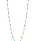 The Gigi Clozeau Classic Gigi Necklace 19.7", fashioned in 18-carat yellow gold, showcases a fine gold chain accented by small turquoise beads evenly distributed along its length, capturing the timeless elegance associated with Gigi Clozeau.